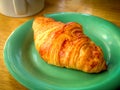 A croissant and a cup of coffee Royalty Free Stock Photo